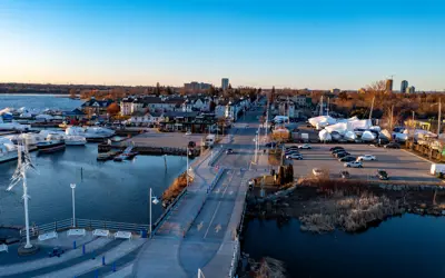 photo of nautical village facing the city from the water